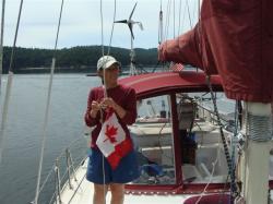 Alison prepared to raise the Canadian courtesy flag
